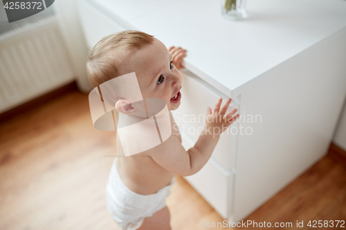 Image of close up of happy little baby boy or girl at home
