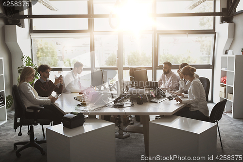 Image of business team with computers working at office