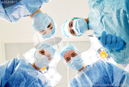 Image of group of surgeons in operating room at hospital