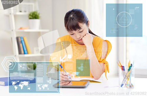 Image of bored asian woman student with tablet pc at home