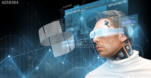 Image of man in virtual reality glasses and microchip