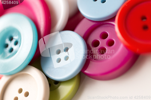 Image of close up of sewing buttons