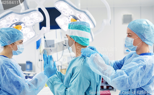 Image of surgeons in operating room at hospital