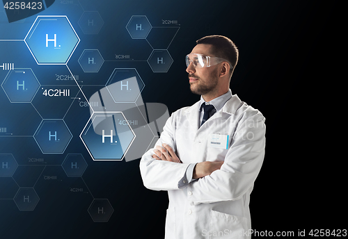 Image of scientist in lab goggles chemical formula