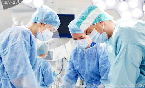 Image of group of surgeons in operating room at hospital