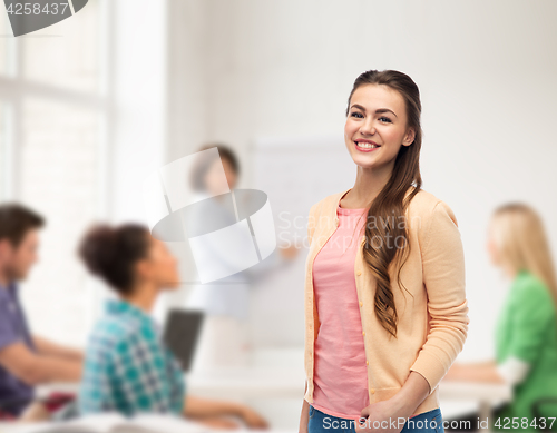 Image of happy smiling young woman in cardigan