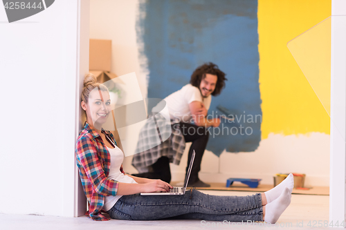 Image of Happy couple doing home renovations
