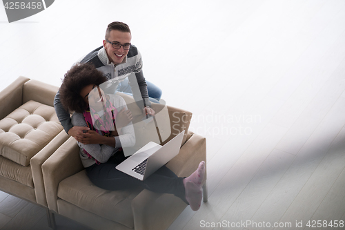 Image of multiethnic couple shopping online