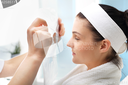 Image of Beautiful woman during treatments in the spa salon