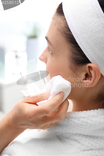 Image of Cleansing facial skin, a woman in beauty salon 