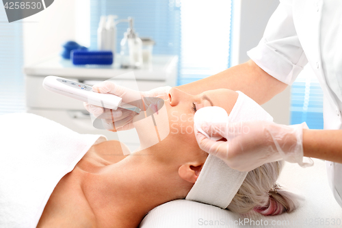 Image of Peeling, ultrasound, woman at vanity