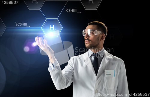 Image of scientist in lab goggles chemical formula