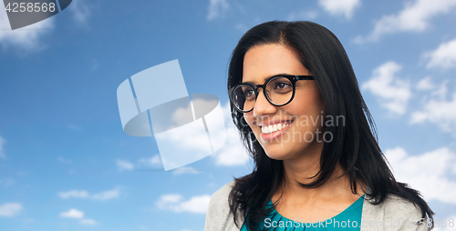 Image of happy smiling young indian woman in glasses