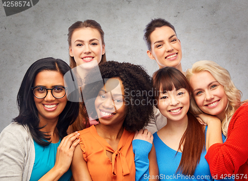 Image of international group of happy women hugging