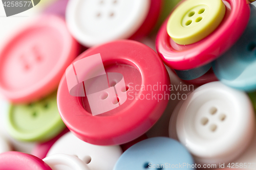 Image of close up of sewing buttons