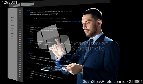 Image of businessman with tablet pc and virtual coding