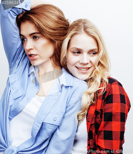 Image of best friends teenage girls together having fun, posing emotional on white background, besties happy smiling, lifestyle people concept close up