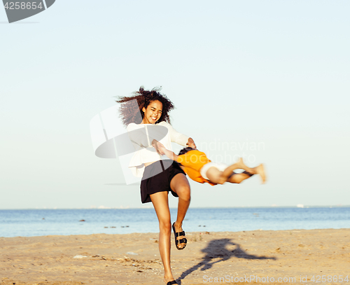 Image of pretty diverse nation and age friends on sea coast having fun, lifestyle people concept on beach vacations close up