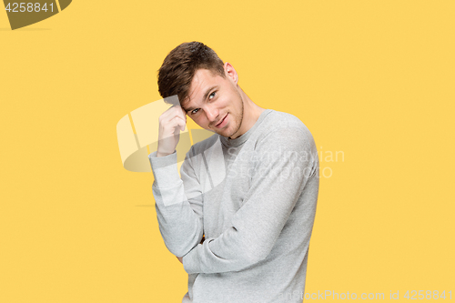 Image of The young man smiling and looking at camera