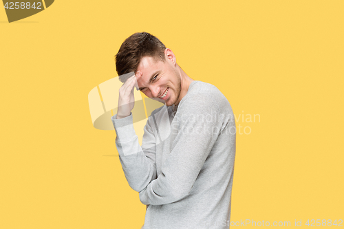 Image of The young man smiling and looking at camera