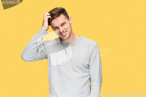 Image of The young man smiling and looking at camera