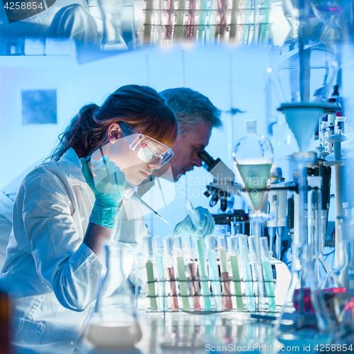 Image of Health care researchers working in scientific laboratory.