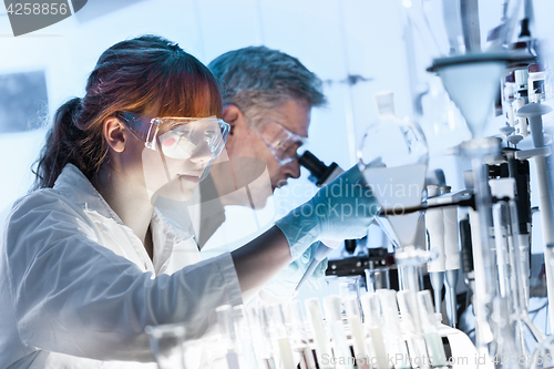 Image of Health care researchers working in scientific laboratory.