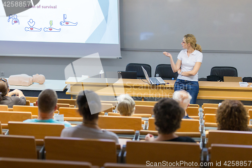 Image of Instructor teaching first aid cardiopulmonary resuscitation workshop.