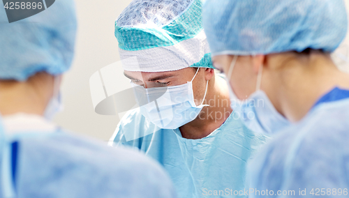 Image of group of surgeons in operating room at hospital