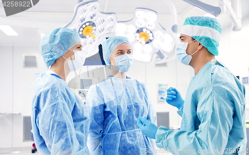 Image of group of surgeons in operating room at hospital