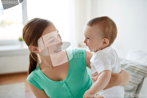 Image of happy young mother with little baby at home