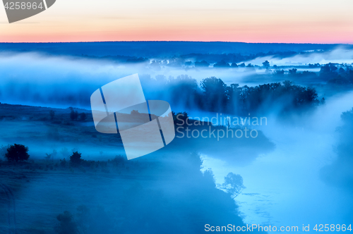 Image of Foggy sunrise on river