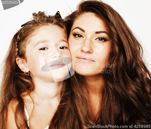 Image of young mother with little cute daughter emotional posing on white