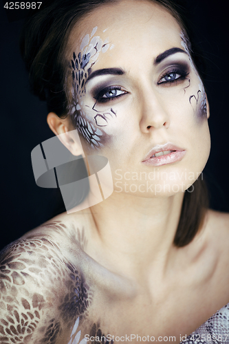 Image of fashion portrait of pretty young woman with creative make up lik