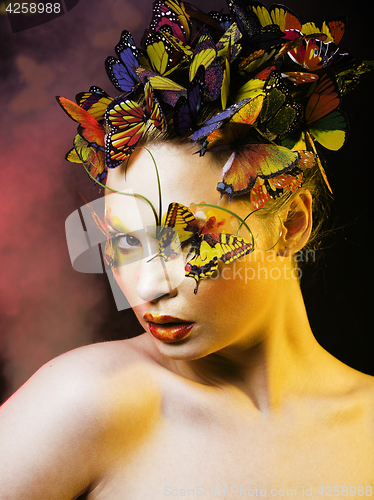 Image of woman with summer creative make up like fairy butterfly closeup 