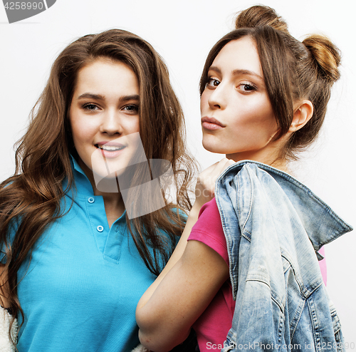 Image of best friends teenage girls together having fun, posing emotional on white background, besties happy smiling, lifestyle people concept close up