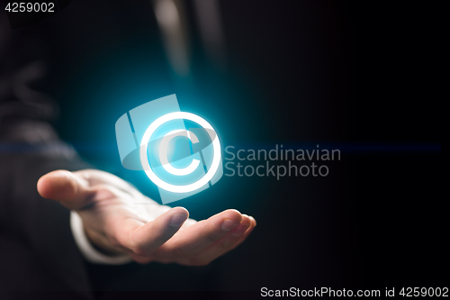 Image of Man holds patent mark ,copyright