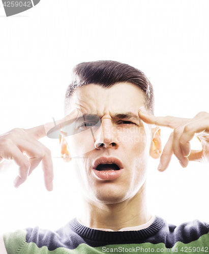 Image of Portrait of a smart serious young man standing against white bac