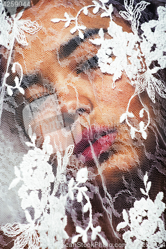 Image of portrait of beauty young afro woman through white lace, like new