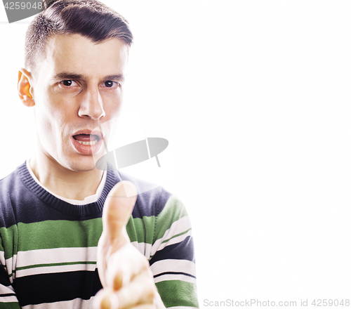 Image of Portrait of a smart serious young man standing against white bac