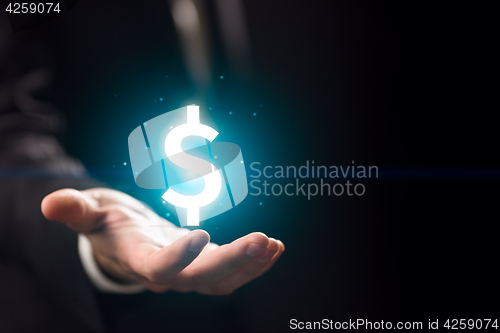 Image of Man hand with dollar icon