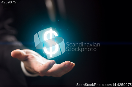 Image of Businessman with ball ,dollar icon.