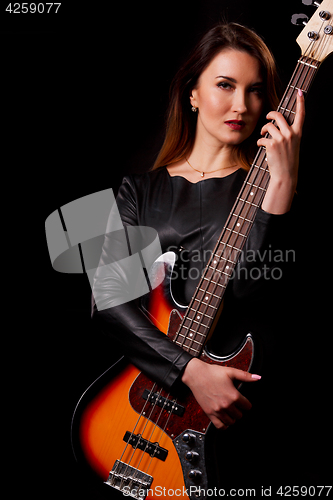 Image of Portrait of singer with guitar