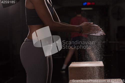 Image of black woman preparing for climbing workout