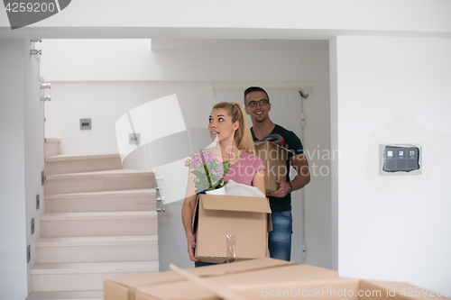 Image of young couple moving into a new home