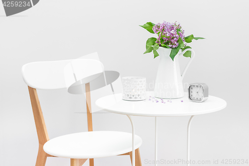 Image of Elegant interior with a bouquet of purple lilacs