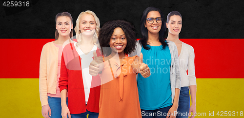 Image of international german women showing thumbs up