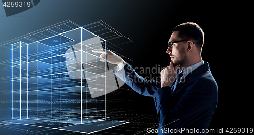 Image of businessman in glasses with virtual building 