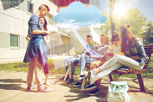 Image of teenage students with tablet pc at school yard