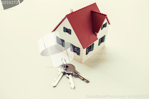 Image of close up of home model and house keys